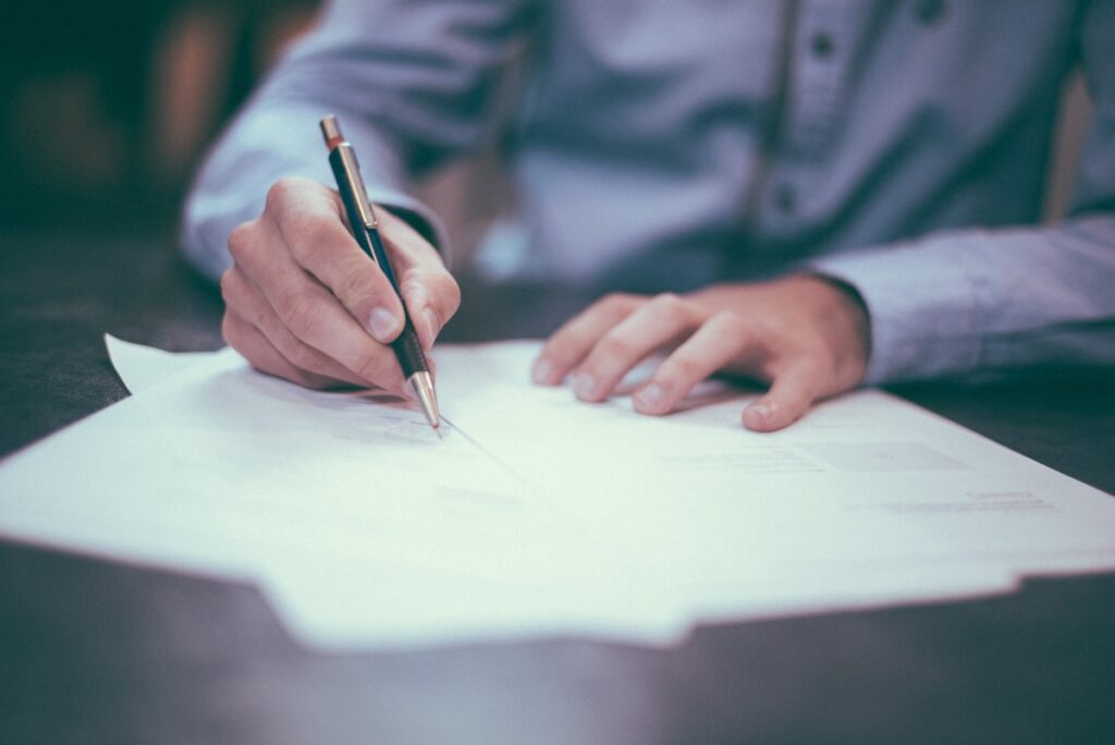Legal documents being signed representing Irish domicile rules