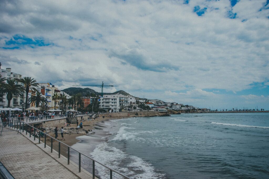 Spain coastline beach view representing non-resident tax guide for expats and property owners