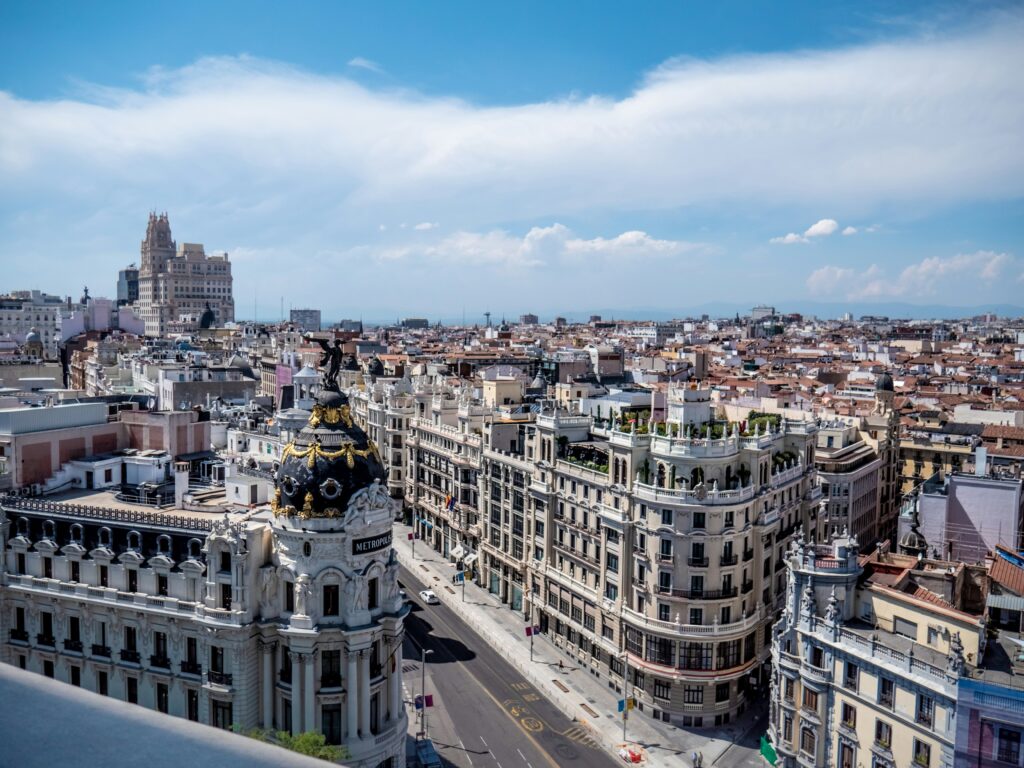 Modern building in Spain financial district representing dividend tax planning for investors